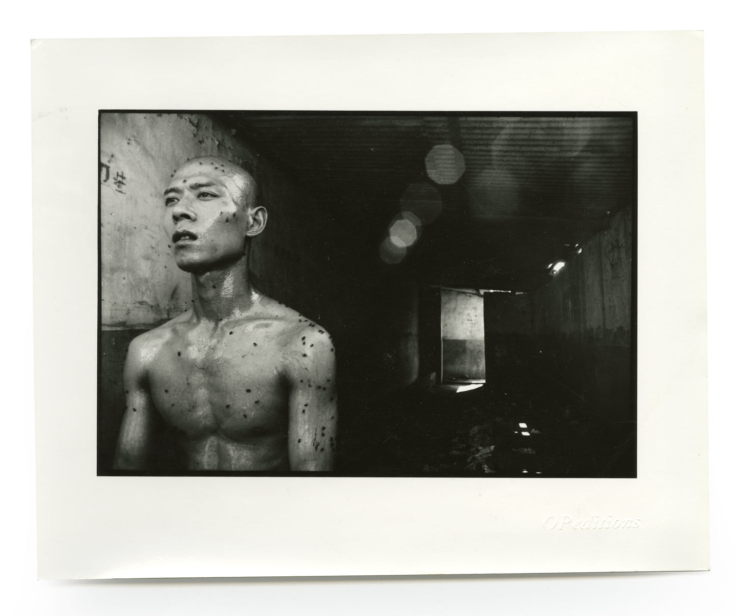 Zhang Huan in the performance “12 Square Meters”