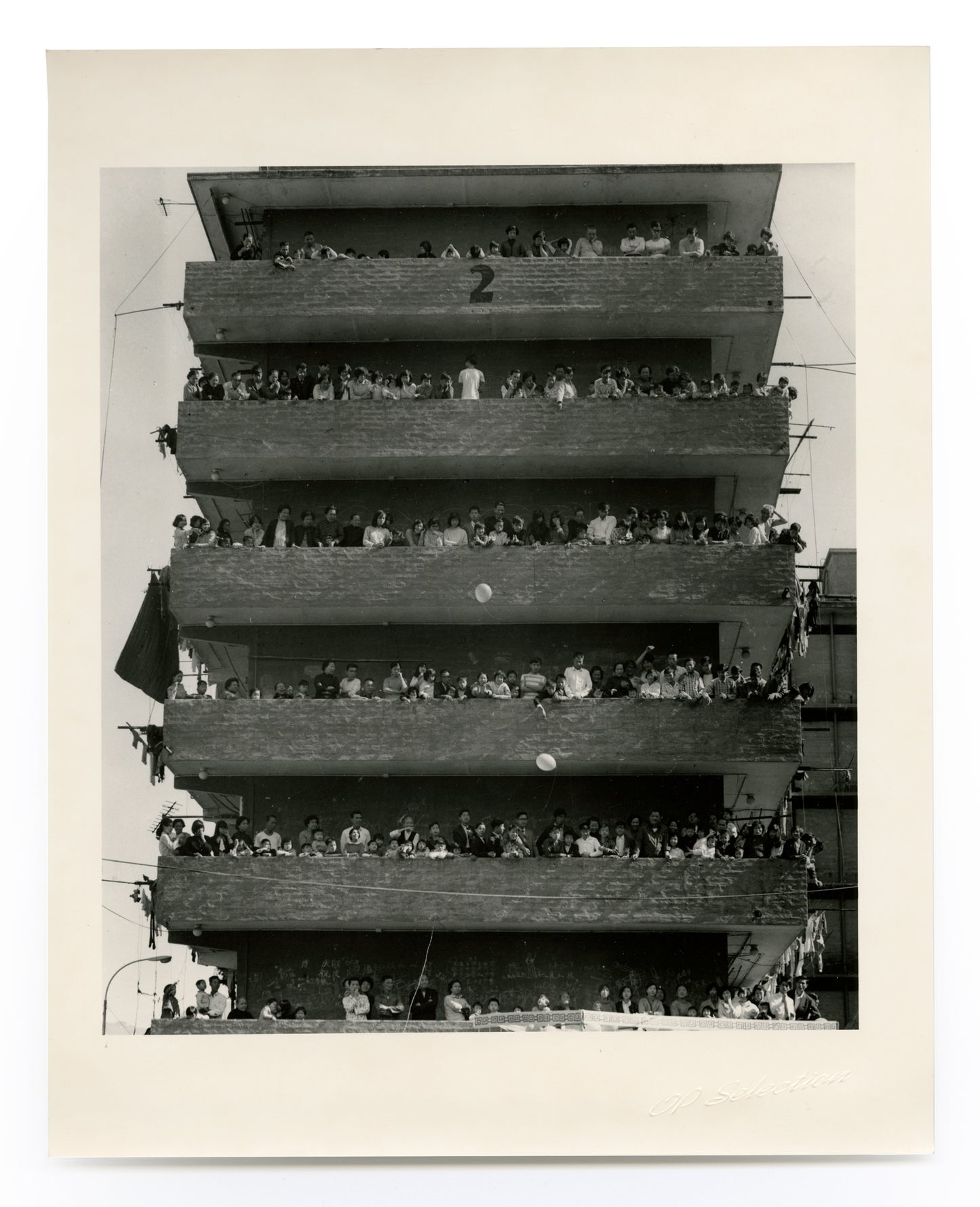 People celebrating in a resettlement building block